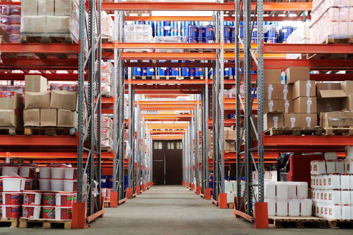 Wide warehouse aisle with stacked shelving